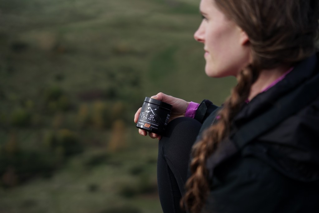 Sisu Stamina bottle in hand of hiker in nature